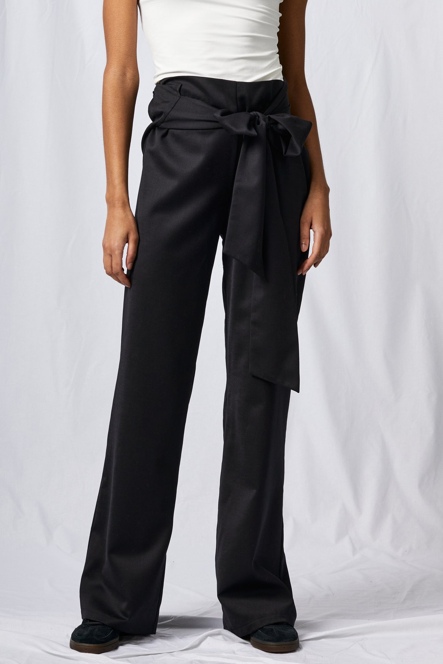 black wool pants on white background
